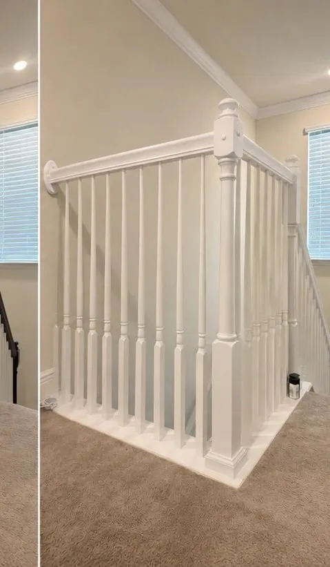 After: Stair railing and handrail refinished from black to white