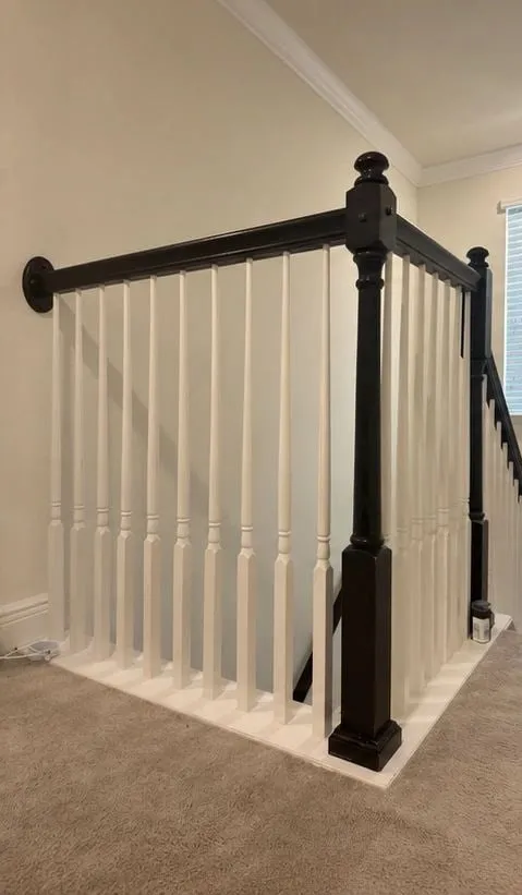 Before: Stair railing and handrail refinished from black to white